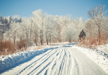 A beautiful winter landscape, a road covered with snow